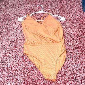 Peach crisscross back bodysuit
